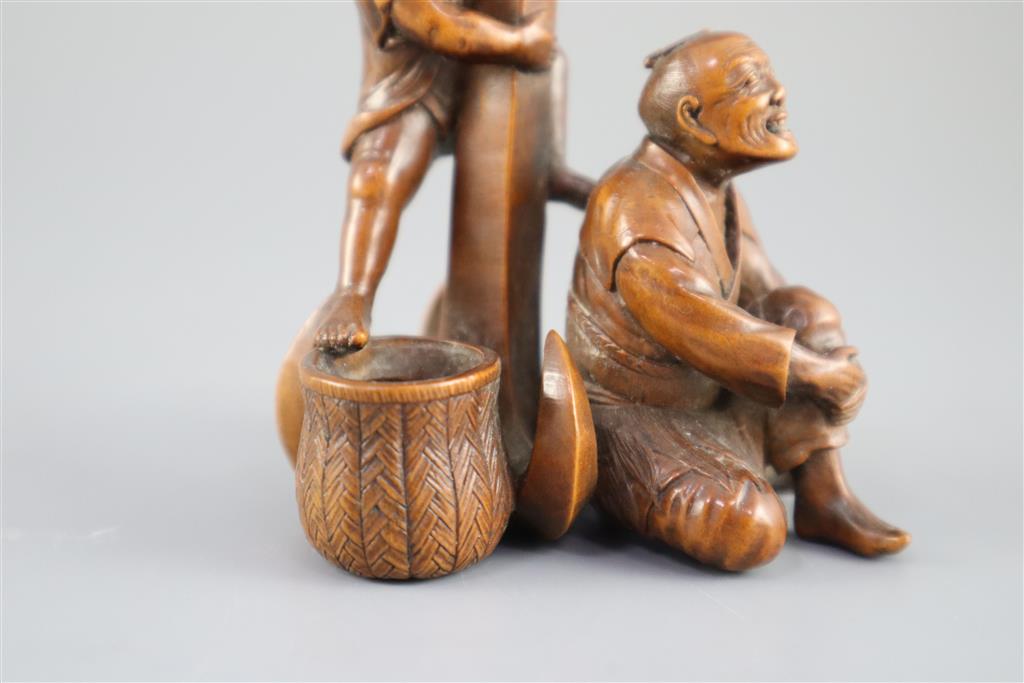 A Japanese boxwood okimono of two sailors and an anchor, Meiji period, 9.5cm high